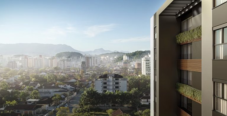 Vista urbana com prédios residenciais modernos, relacionada à análise de moradia e qual o custo de vida em Joinville.
