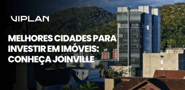 Vista urbana de Joinville com prédios modernos e morros ao fundo, imagem sobre Melhores cidades para investir em imóveis destacando o potencial imobiliário da cidade.