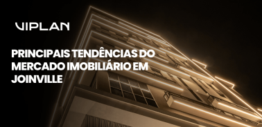 Capa sobre as principais tendências do mercado imobiliário em Joinville, com fachada de edifício residencial moderno.
